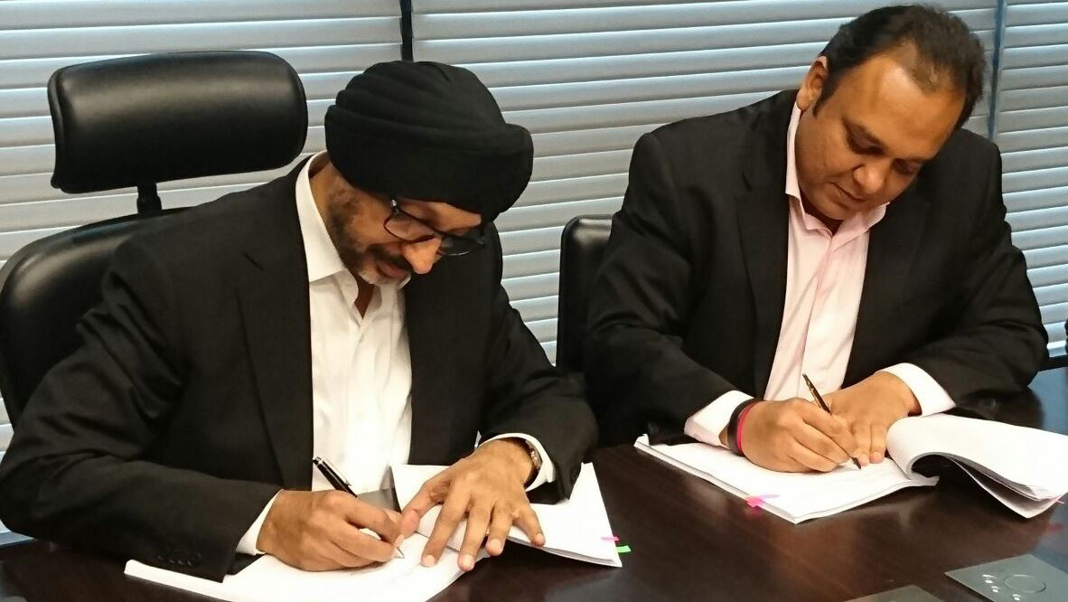 NP Singh and Punit Goenka signing agreement